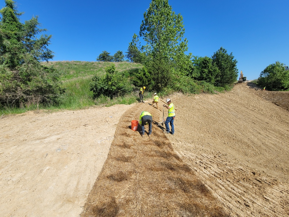 Muller, Inc. crew installs Erosion Control measures to stablize a steep slope.