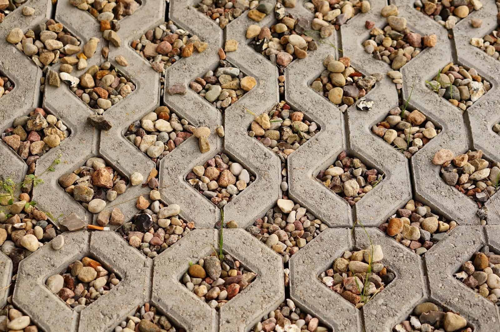 Closeup of a permeable pavement: Concrete tiles with pea gravel to fill in the cracks