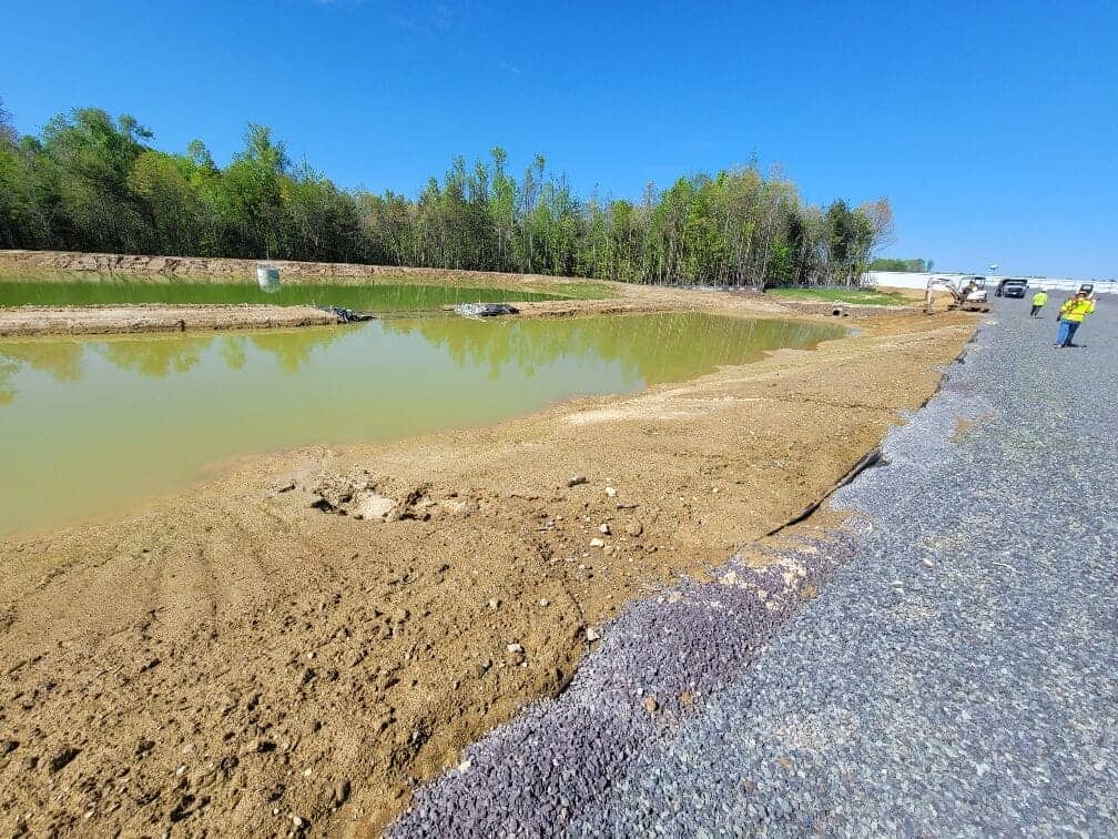 Stormwater management wet pond undergoing maintenance