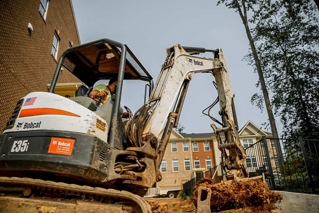 Mini Excavator Digging a Trench
