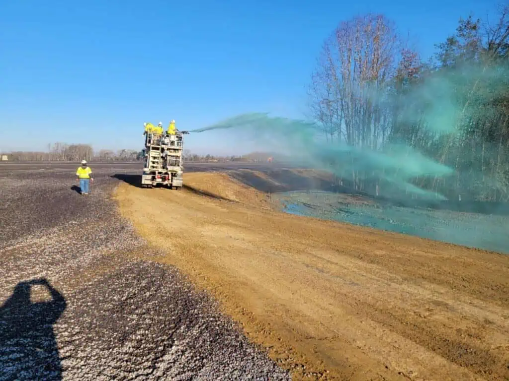 Group of people from Muller Inc. doing commercial hydroseeding on a job site