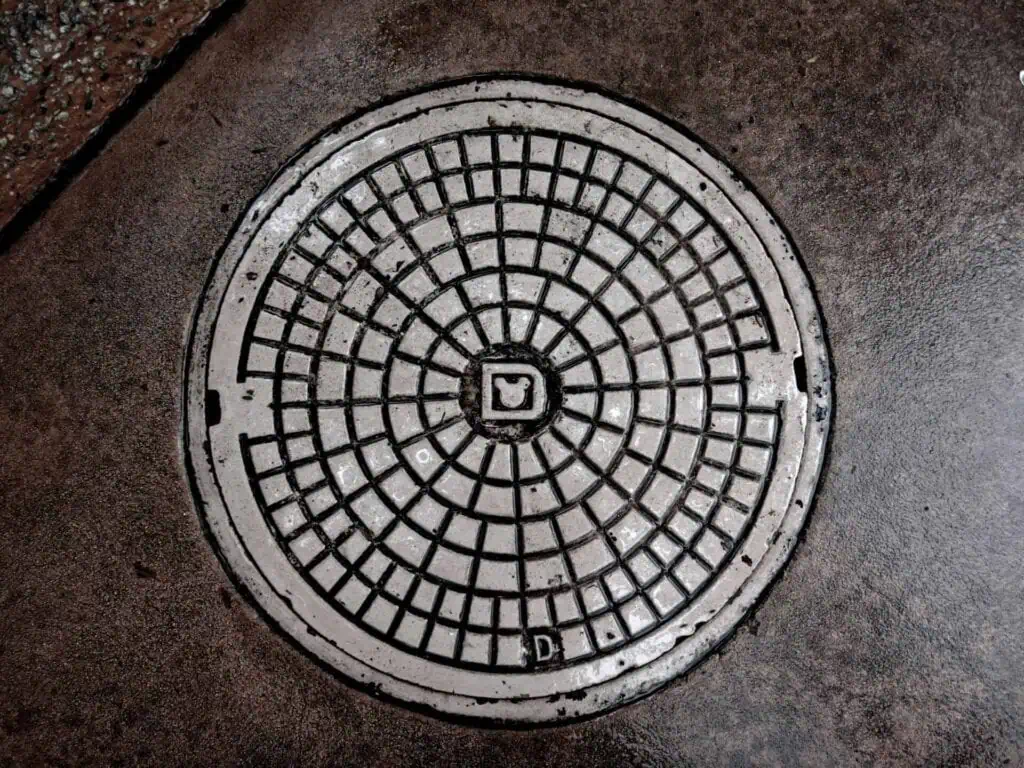 top view of a closed sewer in the ground