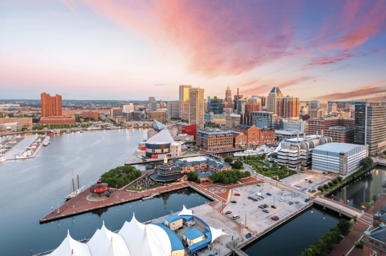 Baltimore Inner Harbor city skyline with waterfront development and urban drainage areas, illustrating stormwater management challenges in dense cities